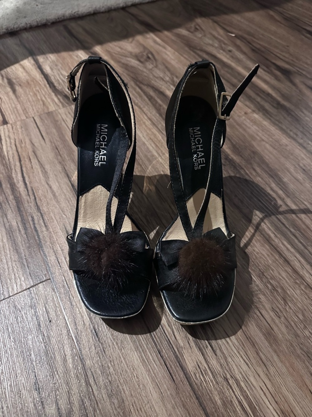 Michael Kors Black Ankle-Strap Heels with Brown Pom-Pom Detail
